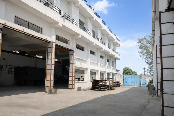 The factory bay door onto the yard