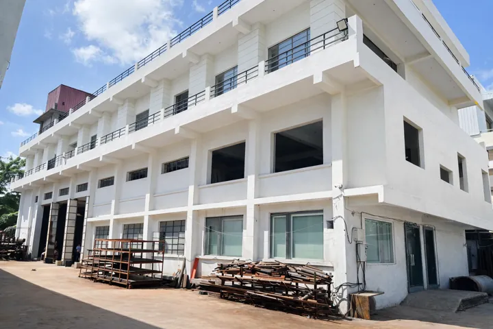 The factory building with material staged outside